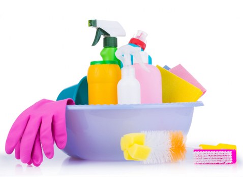 Cleaner tidying a bathroom in a Fulham flat
